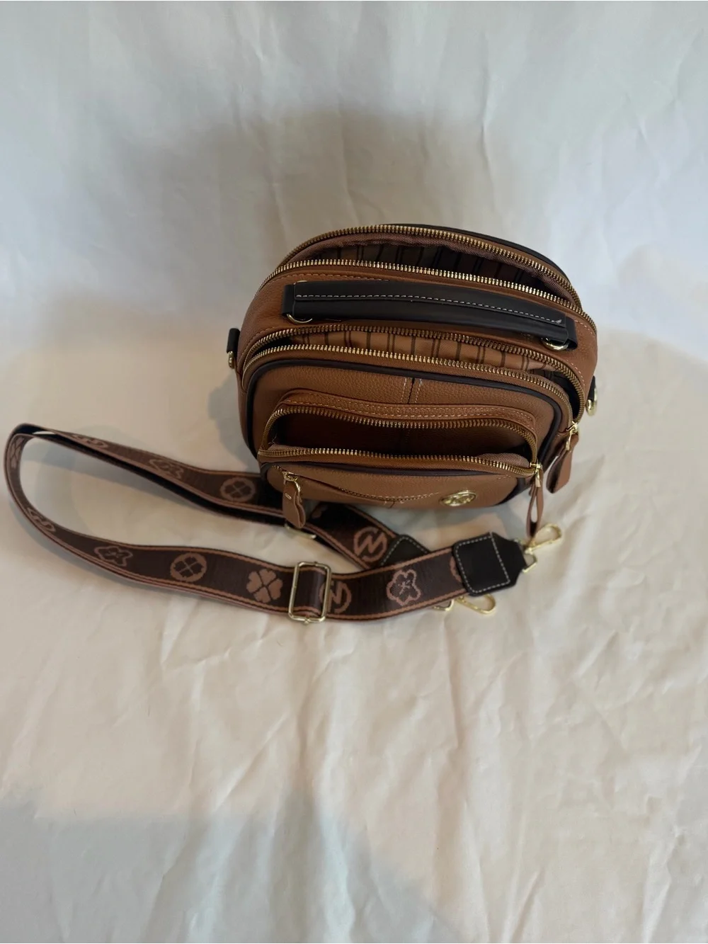 K-Emblem Tan Pebbled Leather Crossbody Bag with Patterned Strap